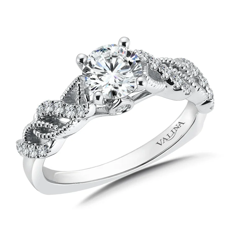 Diamond crisscross engagement ring mounting with beaded detailing and side stones set in 14 k white gold.