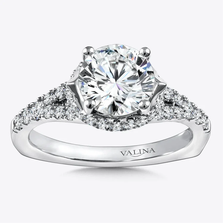 Diamond engagement ring mounting with side stones set in 14k white gold.