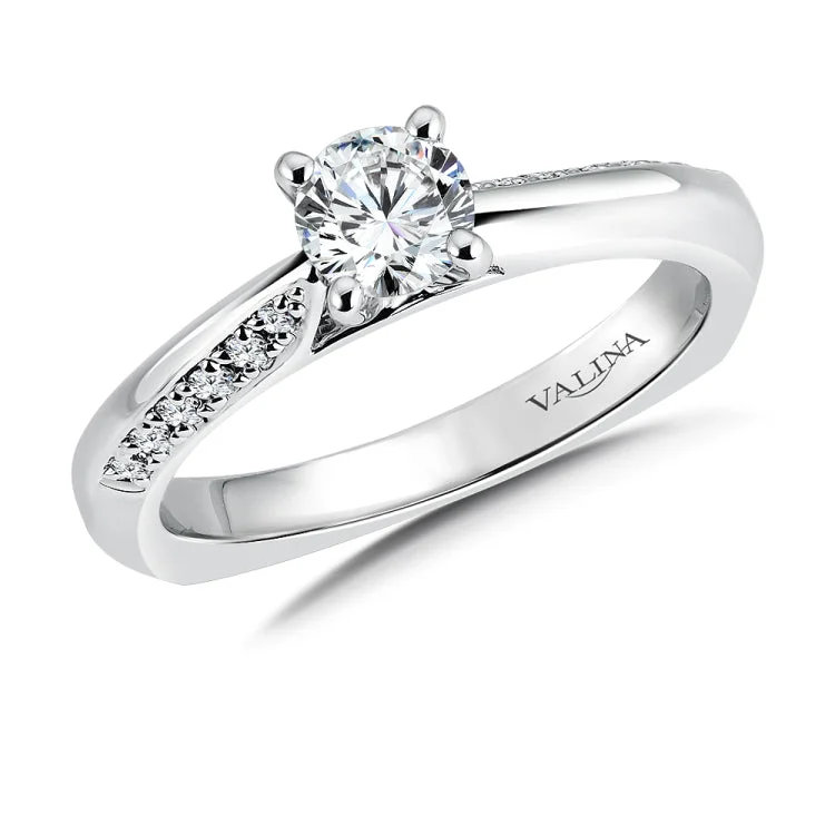 Sleek beveled shoulders of half diamonds and half polished gold light up the center stone in this contemporary design.