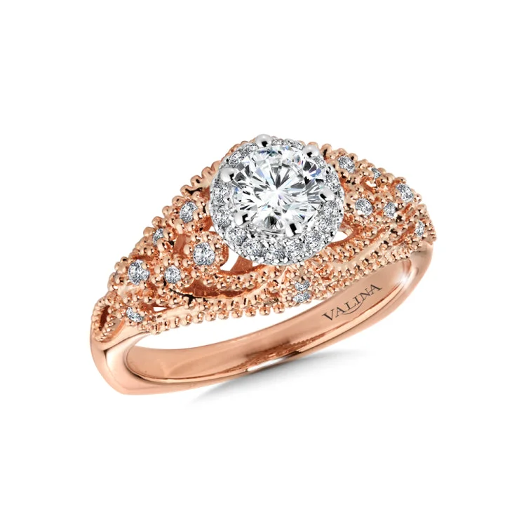 Diamond engagement ring mounting with milgrain detailing and side stones set in 14k rose gold.