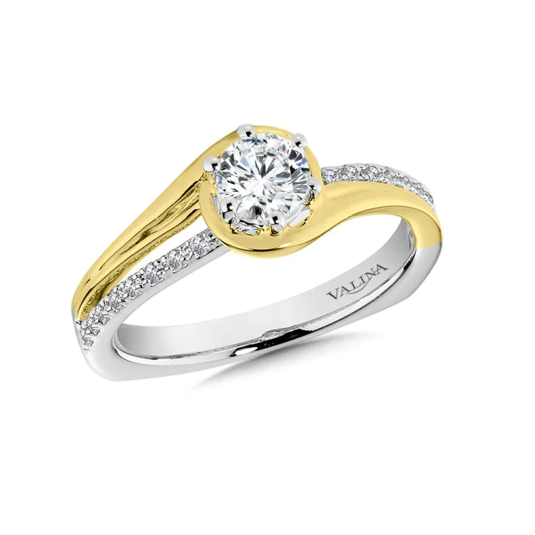 A beautiful white and yellow gold split shank design with a polished yellow gold and pave combination.